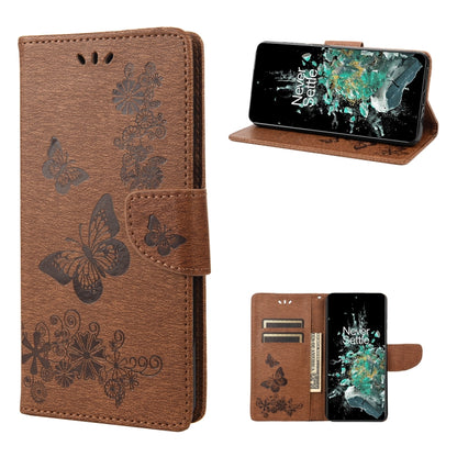 Brown butterfly embossed flip leather phone case showing phone screen and card slots.