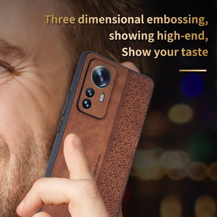 Brown embossed phone case close-up in hand for Xiaomi 12 Pro/12S Pro, camera cutouts