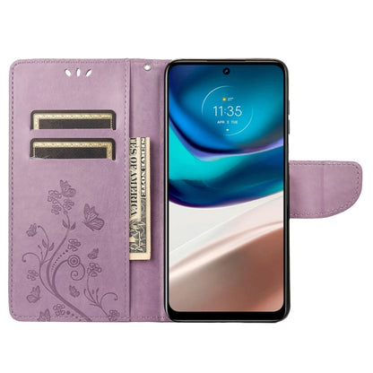 Light purple flip phone case with card slots, butterfly pattern, holding a phone.