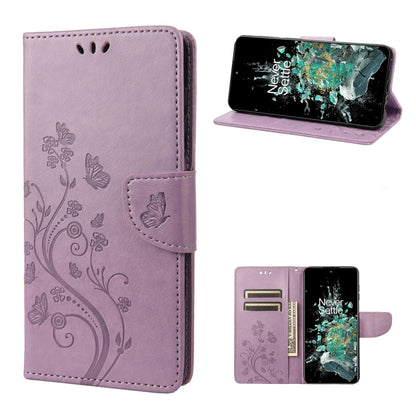 Light purple flip phone case with butterfly and floral swirl pattern, front and wallet view.