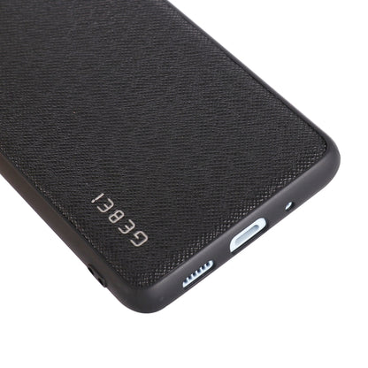 Shockproof leather phone case corner close-up, black with speaker/charging cutouts.