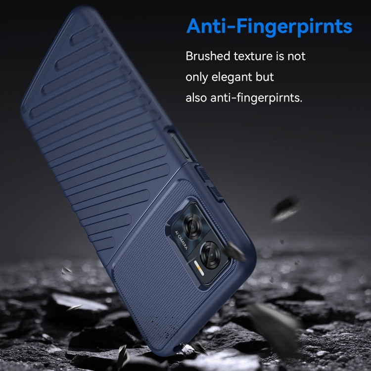 Blue TPU shockproof phone case angled view with ribbed texture and camera module.