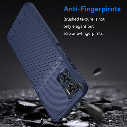 Blue TPU shockproof phone case angled view with ribbed texture and camera module.