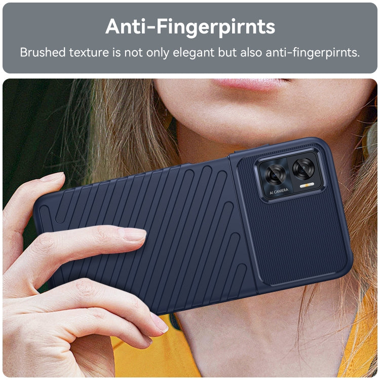 Blue TPU phone case on a phone held in hand; ribbed back and camera cutouts.