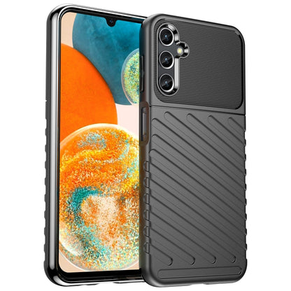 Dark blue TPU phone case with ribbed back and triple-lens camera opening.