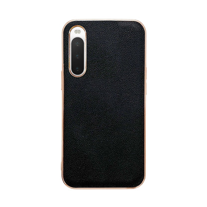 Black leather phone case with smooth textured finish; single camera module cutout.