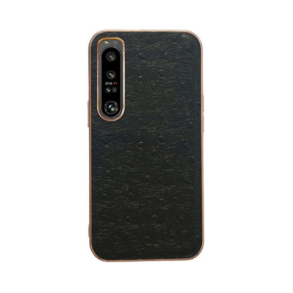 Black ostrich-textured leather phone case with dual camera cutouts