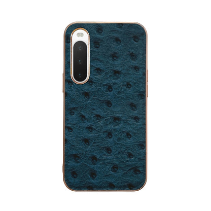 Blue ostrich-textured leather phone case with raised lens frames