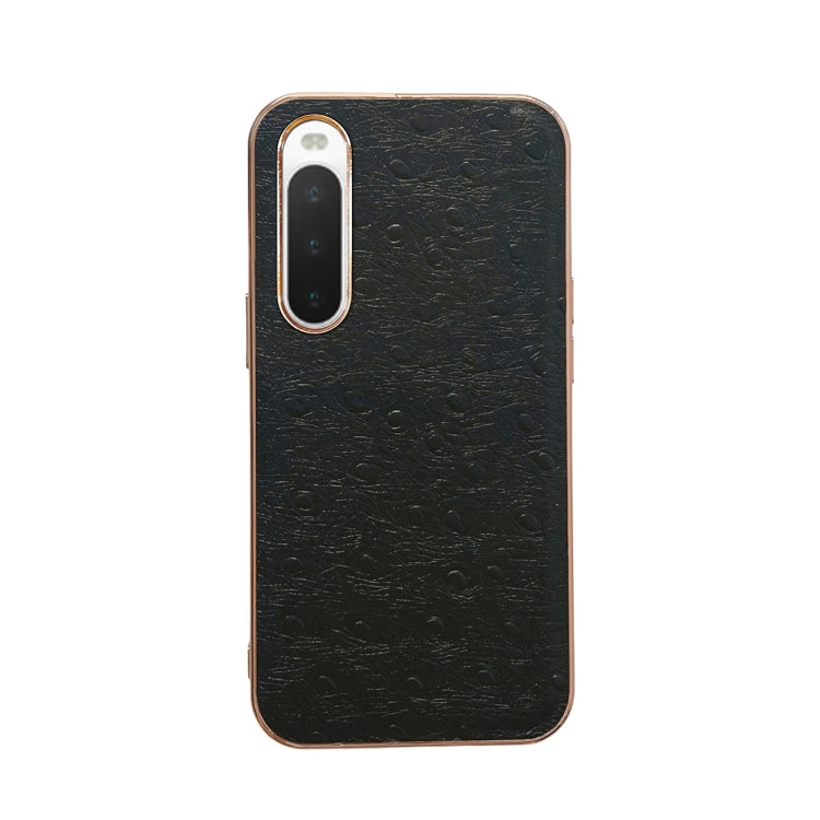 Black ostrich-textured leather phone case with raised lens frames