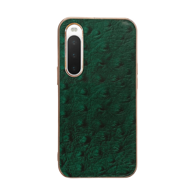 Green ostrich-textured leather phone case with raised lens frames