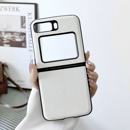 Two-tone litchi-texture PU phone case, white with black trim; held in hand.