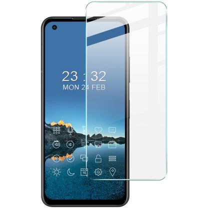 Tempered glass screen protector film on a smartphone front with transparent sheet
