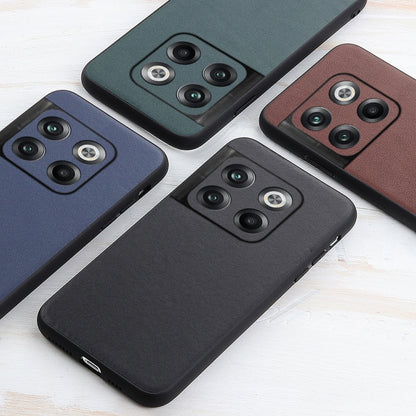 Lambskin-textured leather phone cases in brown, green, blue, and black with camera cutouts