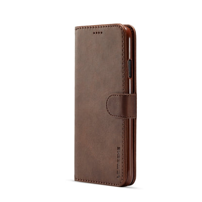 Brown calf-textured leather folio phone case, front view with magnetic strap and stitching