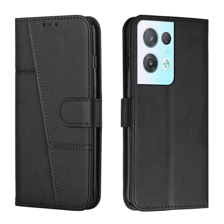 Black leather phone case with stitched texture and front buckle strap, phone camera cutouts