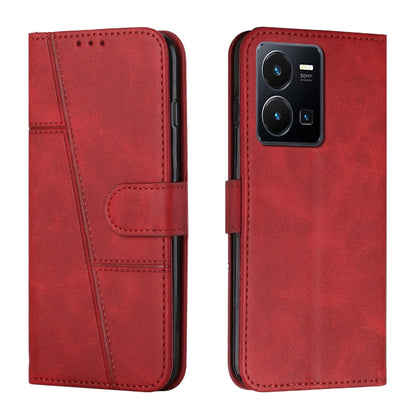 Red leather flip phone case with buckle strap, card slot, and stitched trim lines