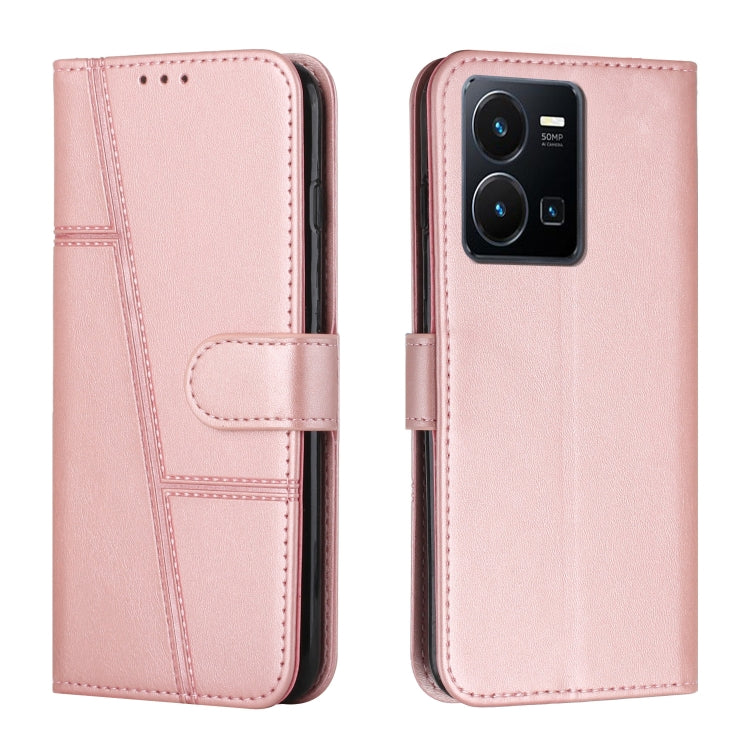 Pink leather flip phone case with buckle strap and card slot, stitched decorative lines