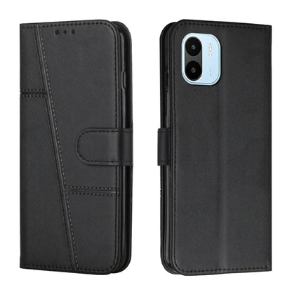 Black leather flip phone case with buckle strap and card slot, stitched front panel