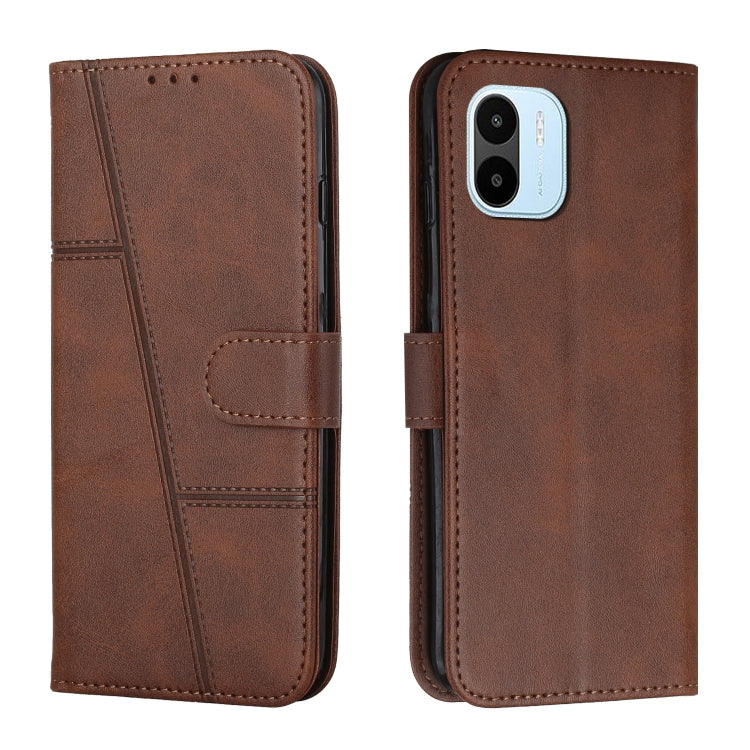 Brown leather flip phone case with buckle strap and card slot, stitched panel design