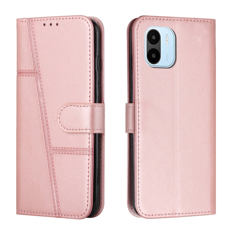 Light pink leather flip phone case with buckle strap and card slot, stitched panel trim