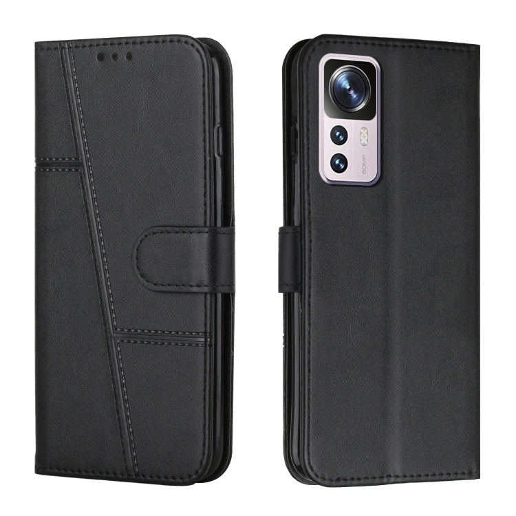 Black leather wallet phone case with buckle strap and stitched design, front and back view