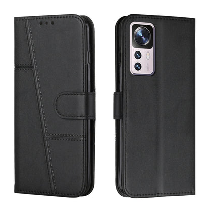 Black leather wallet phone case with buckle strap and stitched design, front and back view
