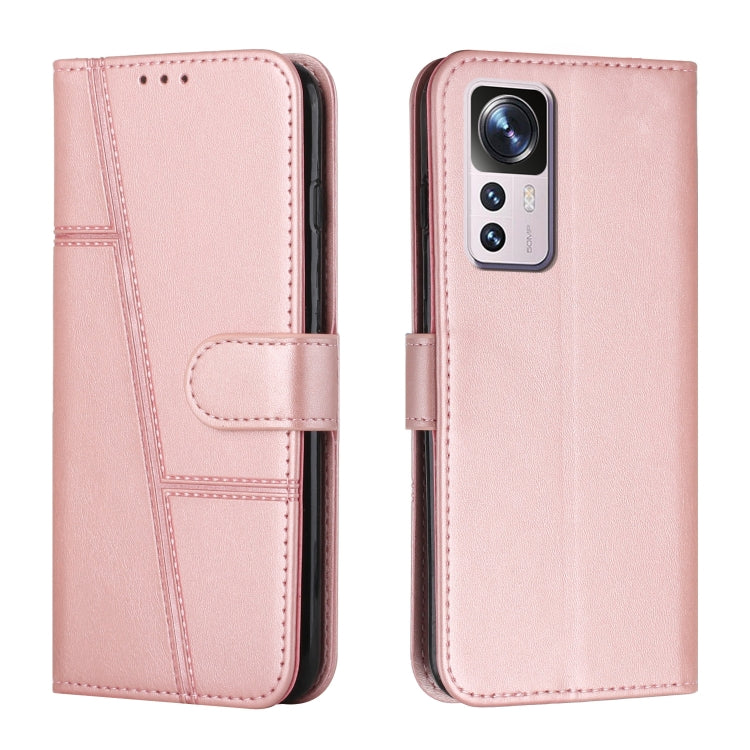 Pink leather wallet phone case with buckle strap and stitched details, front and back view