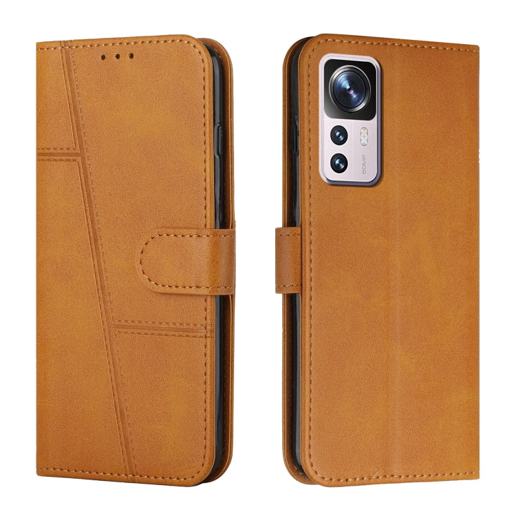 Tan-brown leather wallet phone case with buckle strap and stitching, front and back view
