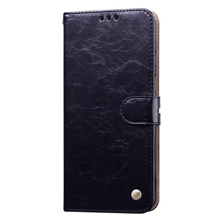 Black leather flip phone case with magnetic clasp and card slots, front view, stitched edges.