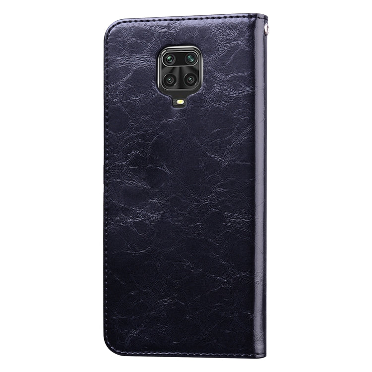 Black leather phone flip case, cover closed, camera cutout on back, textured finish.