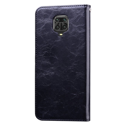 Black leather phone flip case, cover closed, camera cutout on back, textured finish.