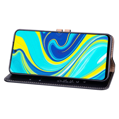 Black leather flip phone case with stand-style cover, screen visible, camera cutout area.