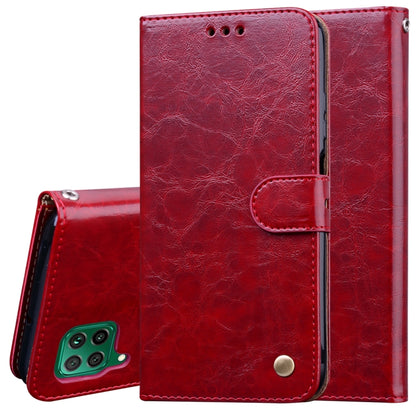 Red leather-style flip phone wallet case with camera cutout and card pocket