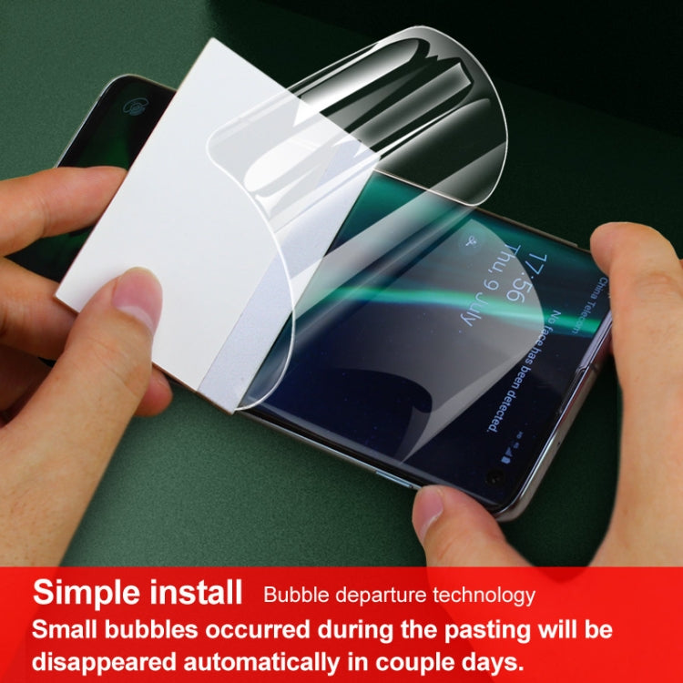 Hands applying curved hydrogel back protector film to phone back, 2-pack