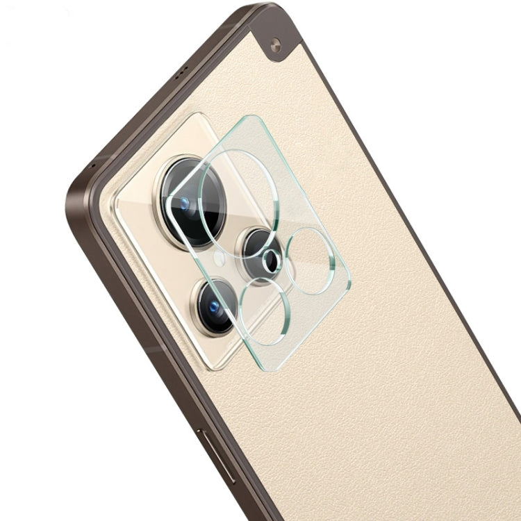 Clear phone camera lens glass film on rear lenses of gold-toned phone