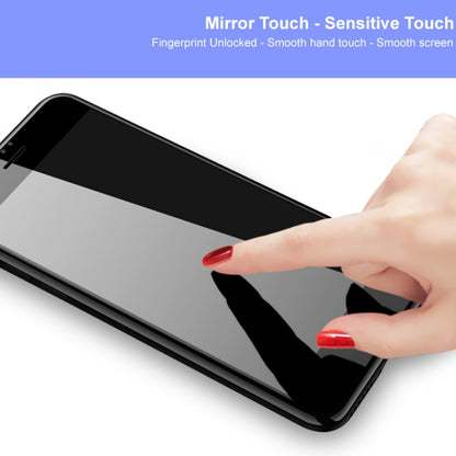 Clear tempered glass screen protector film on smartphone screen with finger touch
