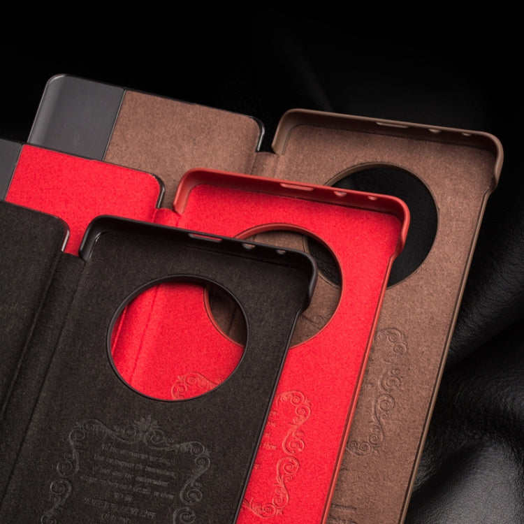 Leather smartphone case cutouts with side-window opening and camera ring protection.