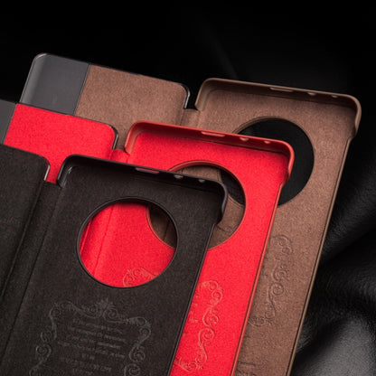 Leather smartphone case cutouts with side-window opening and camera ring protection.
