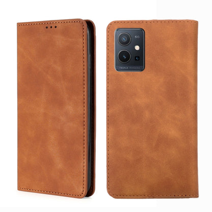 Tan leather flip phone case with stitched edges and rear triple-camera cutout