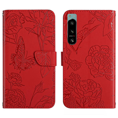 Red butterfly-embossed flip phone case with camera cutout and card slot