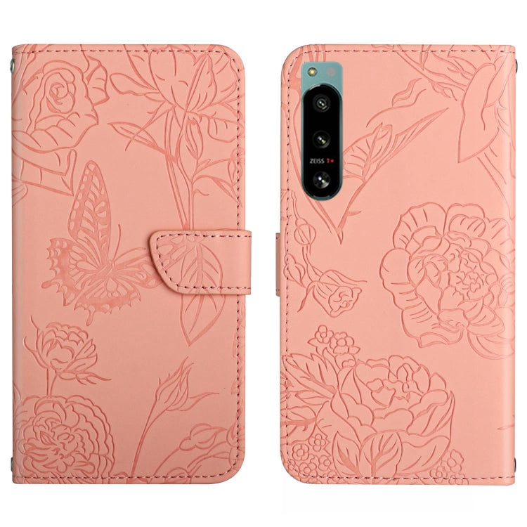 Pink butterfly-embossed flip phone case with camera cutout and card slot
