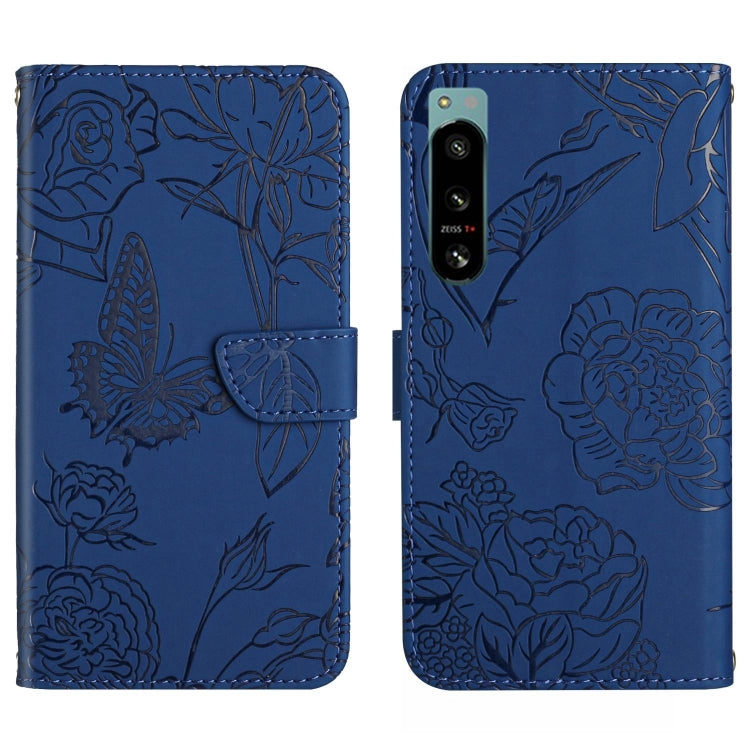 Blue butterfly-embossed flip phone case with camera cutout and card slot