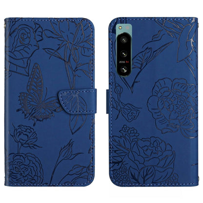 Blue butterfly-embossed flip phone case with camera cutout and card slot