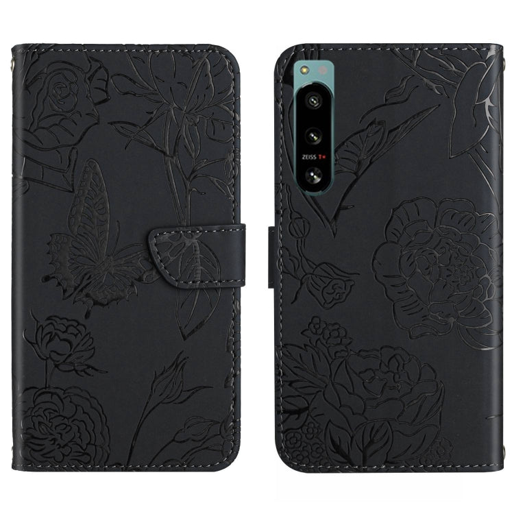 Black butterfly-embossed flip phone case with camera cutout and card slot