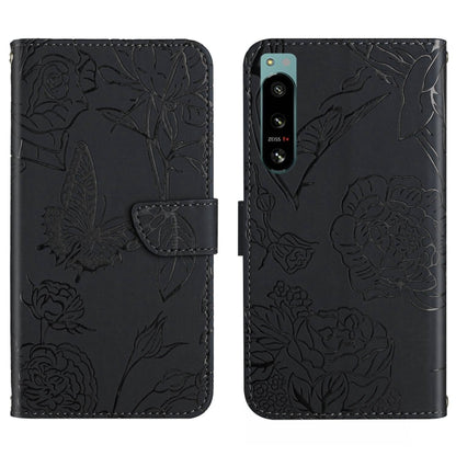 Black butterfly-embossed flip phone case with camera cutout and card slot