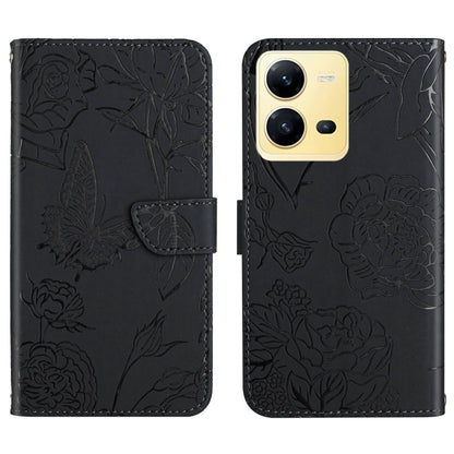 Black butterfly embossed flip leather phone case with front flap and camera openings.