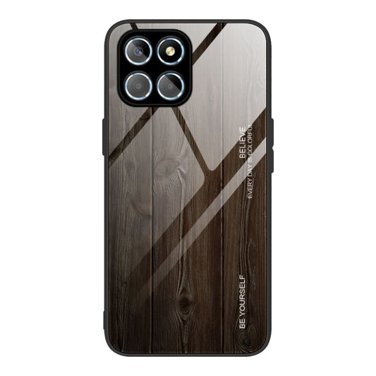 Wood grain glass phone case with dark brown and grey geometric pattern, camera cutout