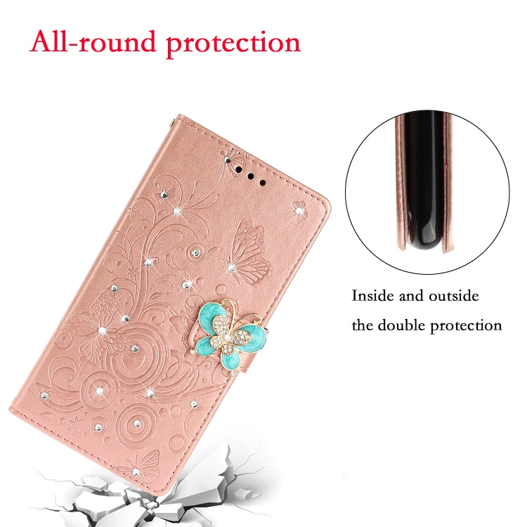 Rose gold embossed butterfly leather phone case with rhinestone floral detail