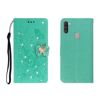 Green butterfly rhinestone embossed phone wallet case with card slot and strap.