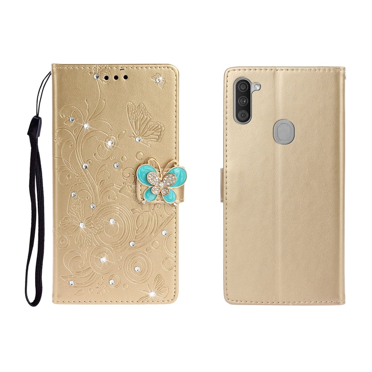 Gold butterfly rhinestone embossed phone wallet case with card slot and strap.